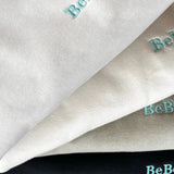 A Stack of Mens Heavy 400gsm Crew Neck  Jumpers with embroidered details on the sleeves and chest.